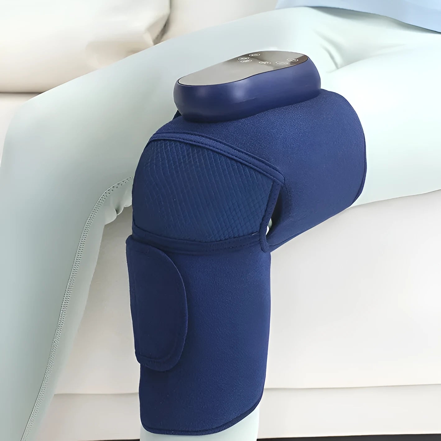 Airbag blue self-heating knee massager showing adjustable strap and control panel for heat, vibration, and air pressure functions.