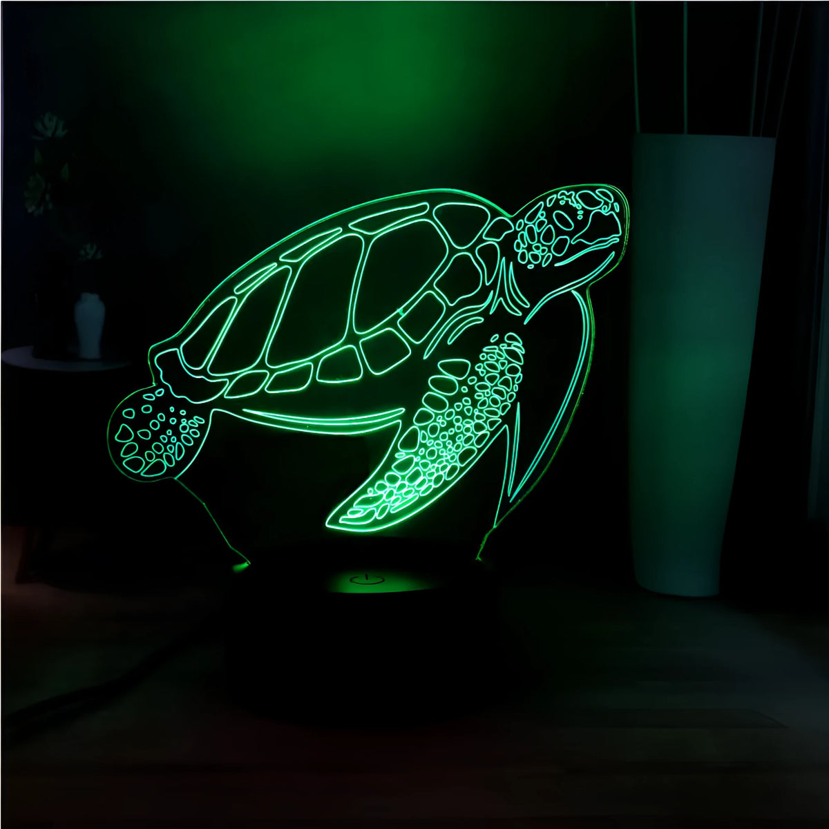 3D clear acrylic turtle-shaped LED night light with multi-colour glow on a surface.