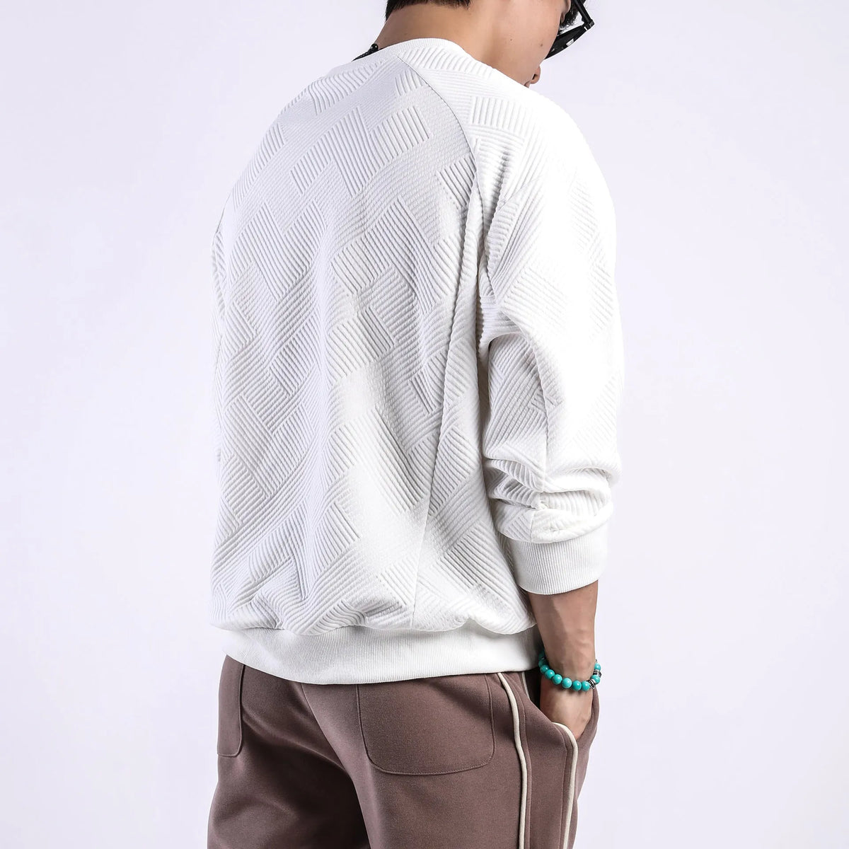 Men's twill jacquard long sleeve pullover sweater in loose fit with round neck
