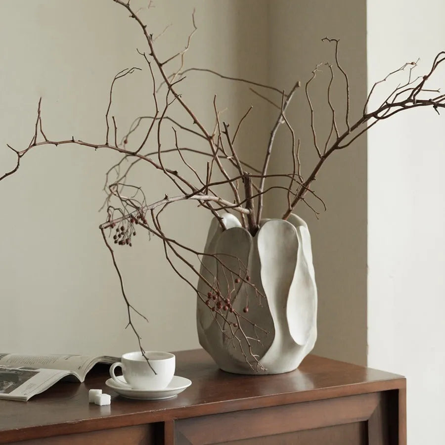Irregular ceramic vase for flower arrangements in magnesium clay with natural textured finish