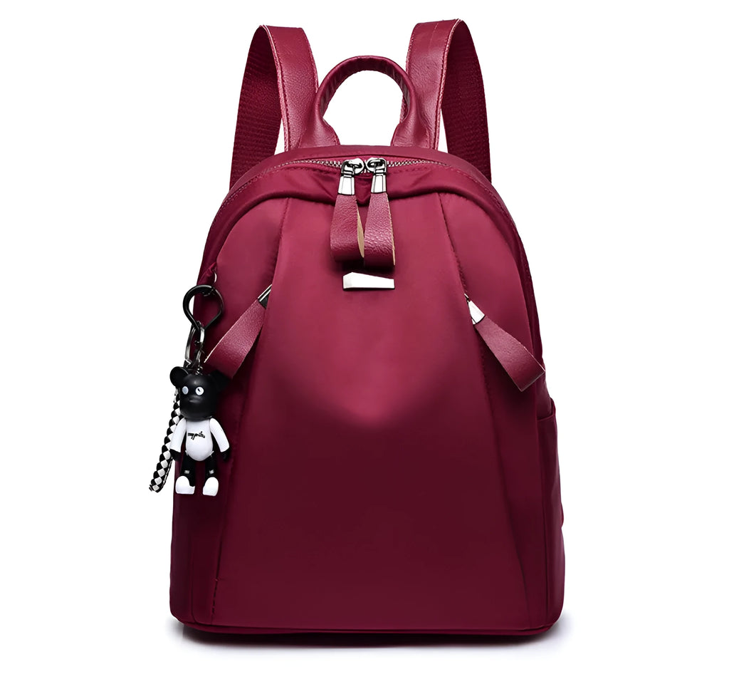 Medium square grey Oxford cloth rucksack with double straps, shown open to reveal internal phone and organiser pockets.