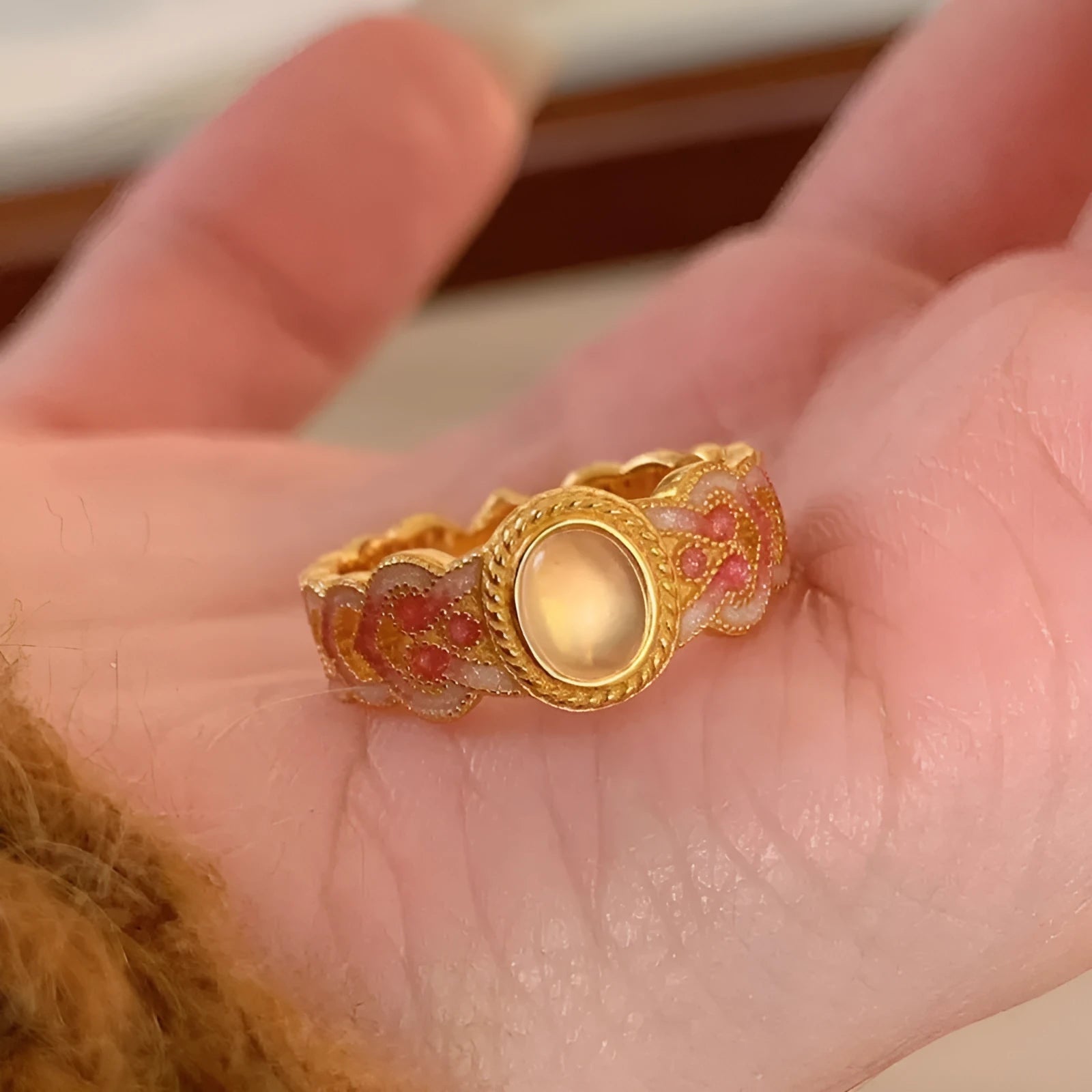 Open geometric ring with pink crystal enamel decoration and gold-plated finish, adjustable design