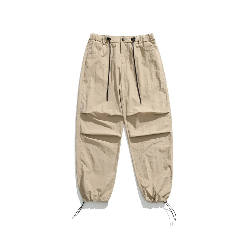 Men's straight-leg loose fit casual trousers in nylon fabric, shown in various colours including black and army green.