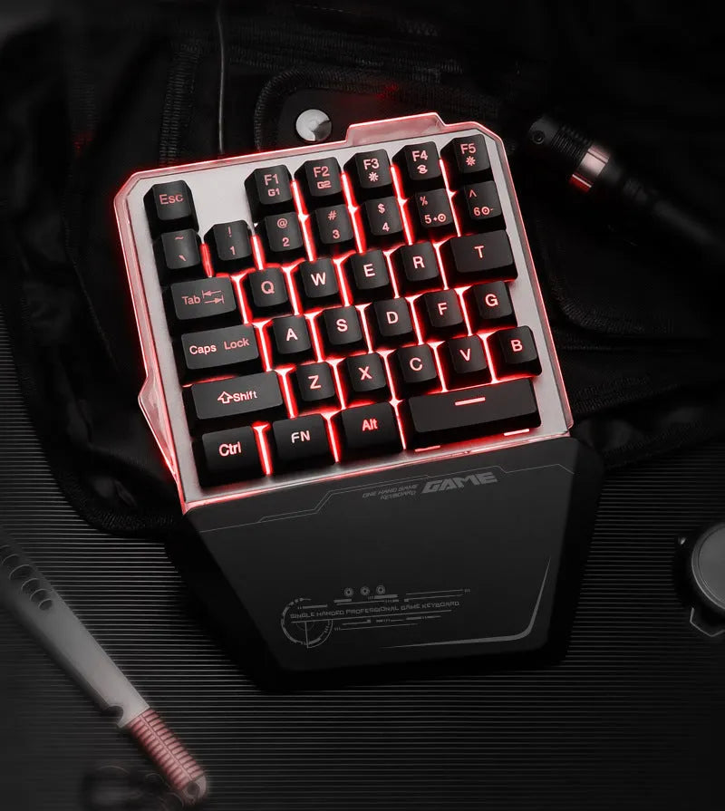 Black robotic one-handed gaming keyboard with RGB backlit keys and USB cable