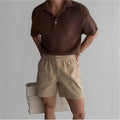 Cotton loose fit sports shorts in black, shown on a model for summer activewear.