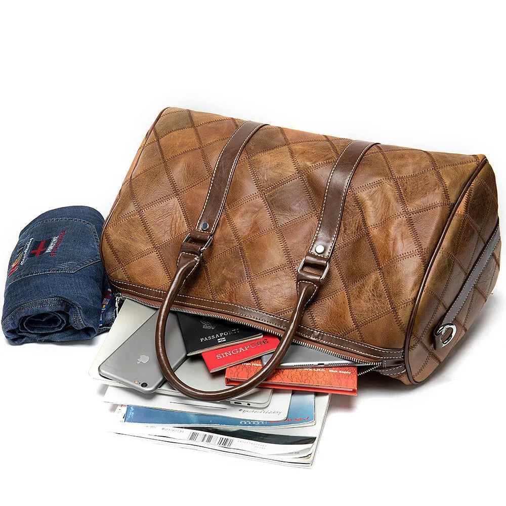 Men's vintage duffel bag in top layer cowhide leather with single strap and internal compartments