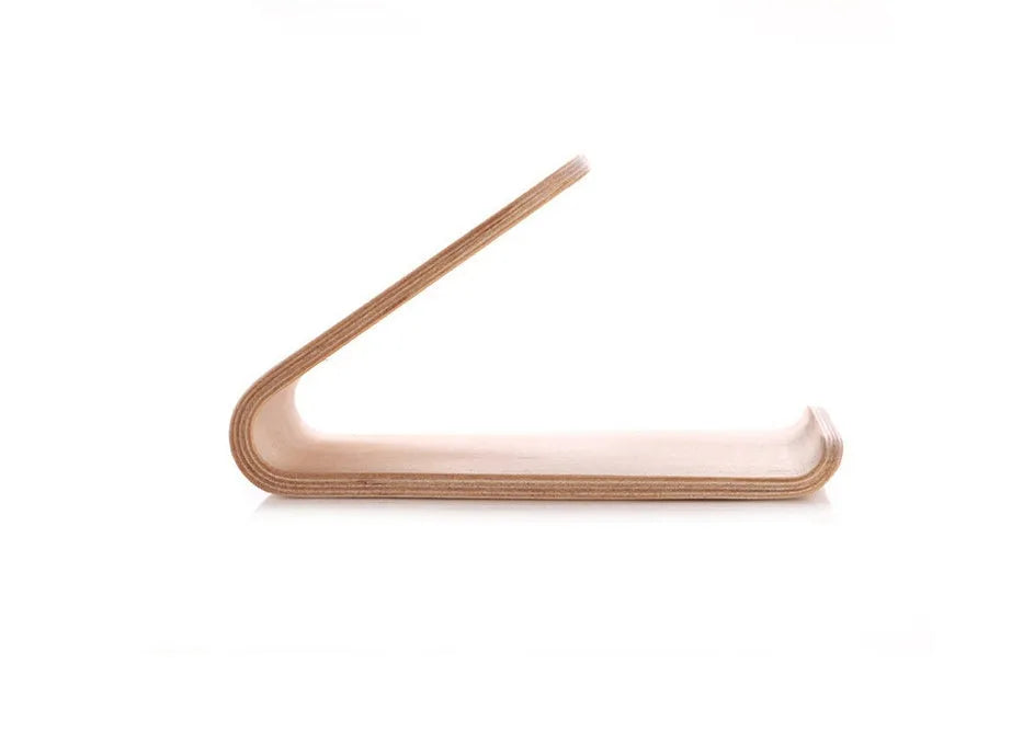 Wooden phone charging stand for iPhone in walnut or white maple finish on a desk.