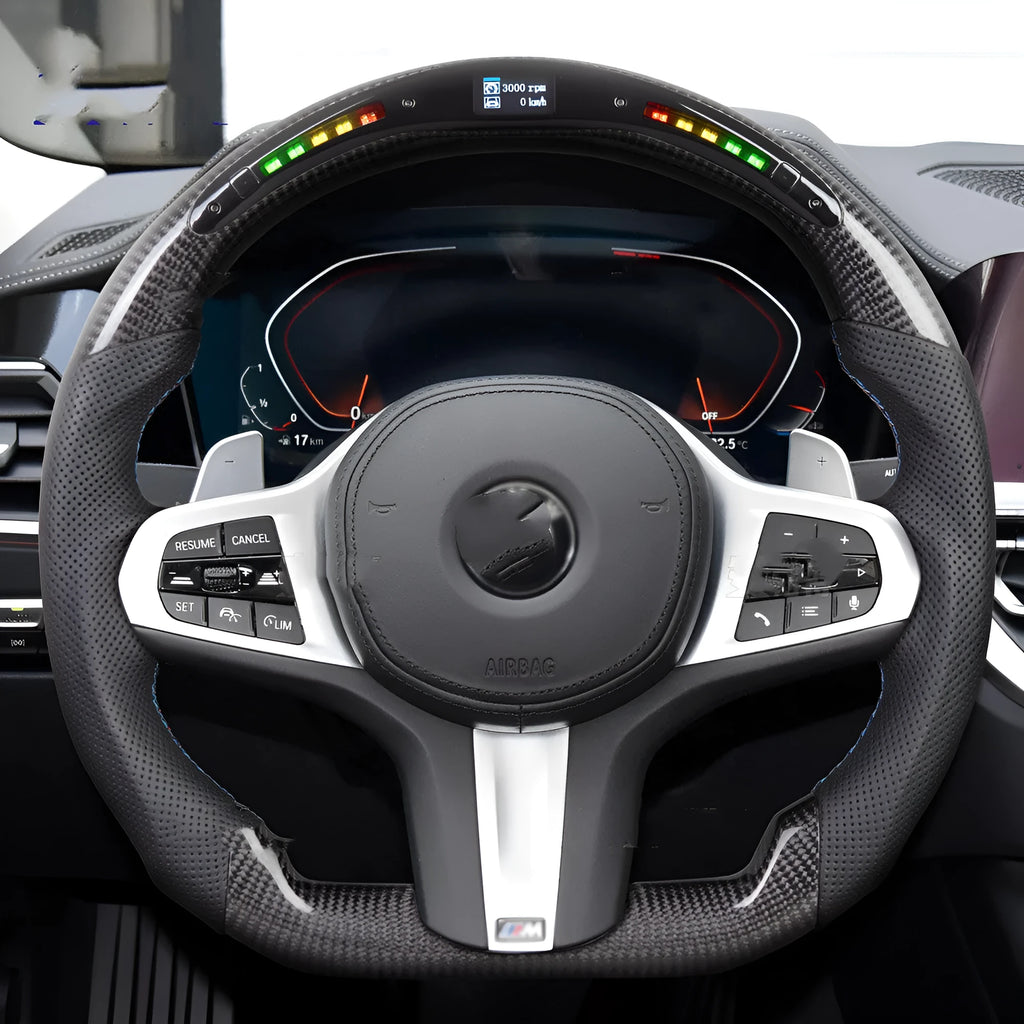 Black carbon fibre steering wheel for BMW with integrated LED display and heating function.