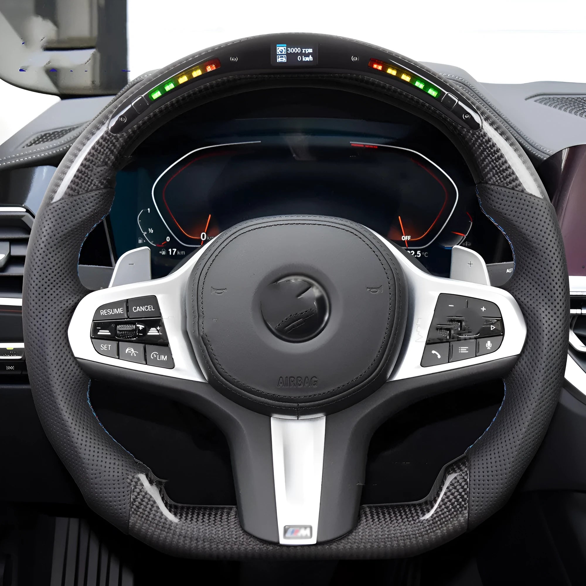 Black carbon fibre steering wheel for BMW with integrated LED display and heating function.