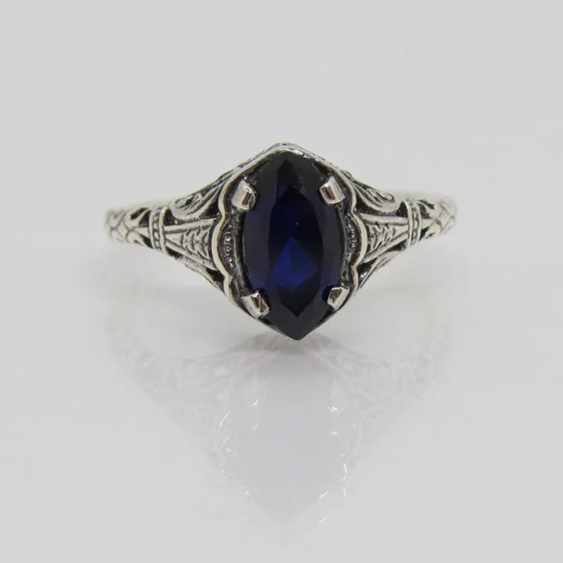 Silver women's ring with geometric hollow pattern, shown in size US7.