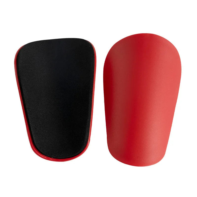 PU mini shin guards in black, white, red and blue for football and outdoor sports