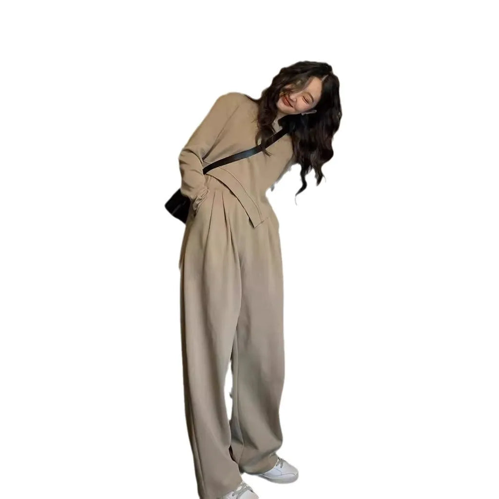 Brown women's loose fit casual sports suit set with long sleeve top and trousers on a model.