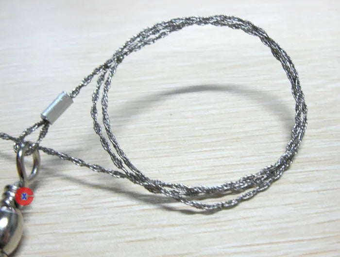 Stainless steel survival wire saw with thumb rings showing 55cm blade and pull ring assembly