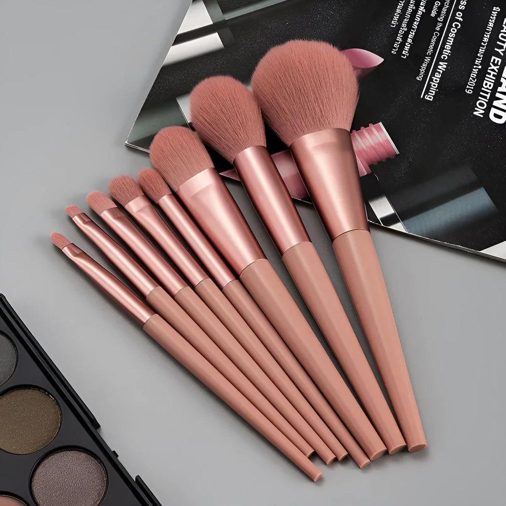 8-piece pink makeup brush set with man-made fibre heads and portable plastic handles, no bag included