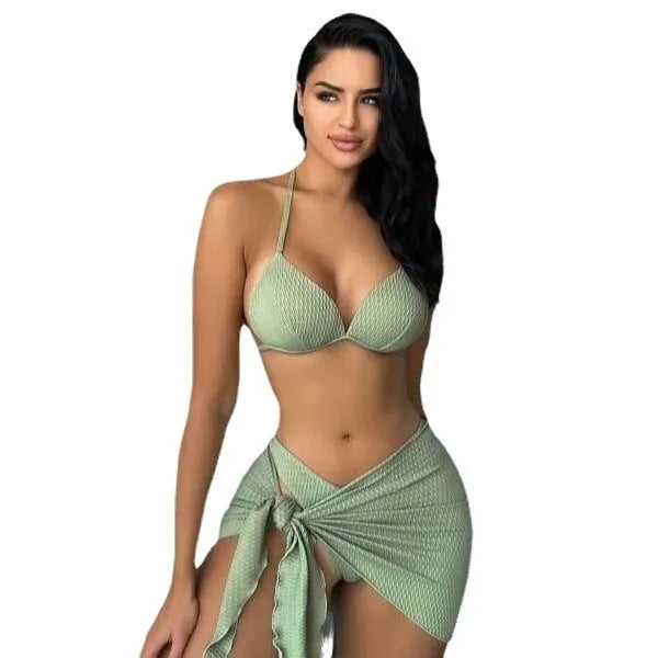 Women's black three-piece swimsuit set showing top, briefs, and skirt laid flat.