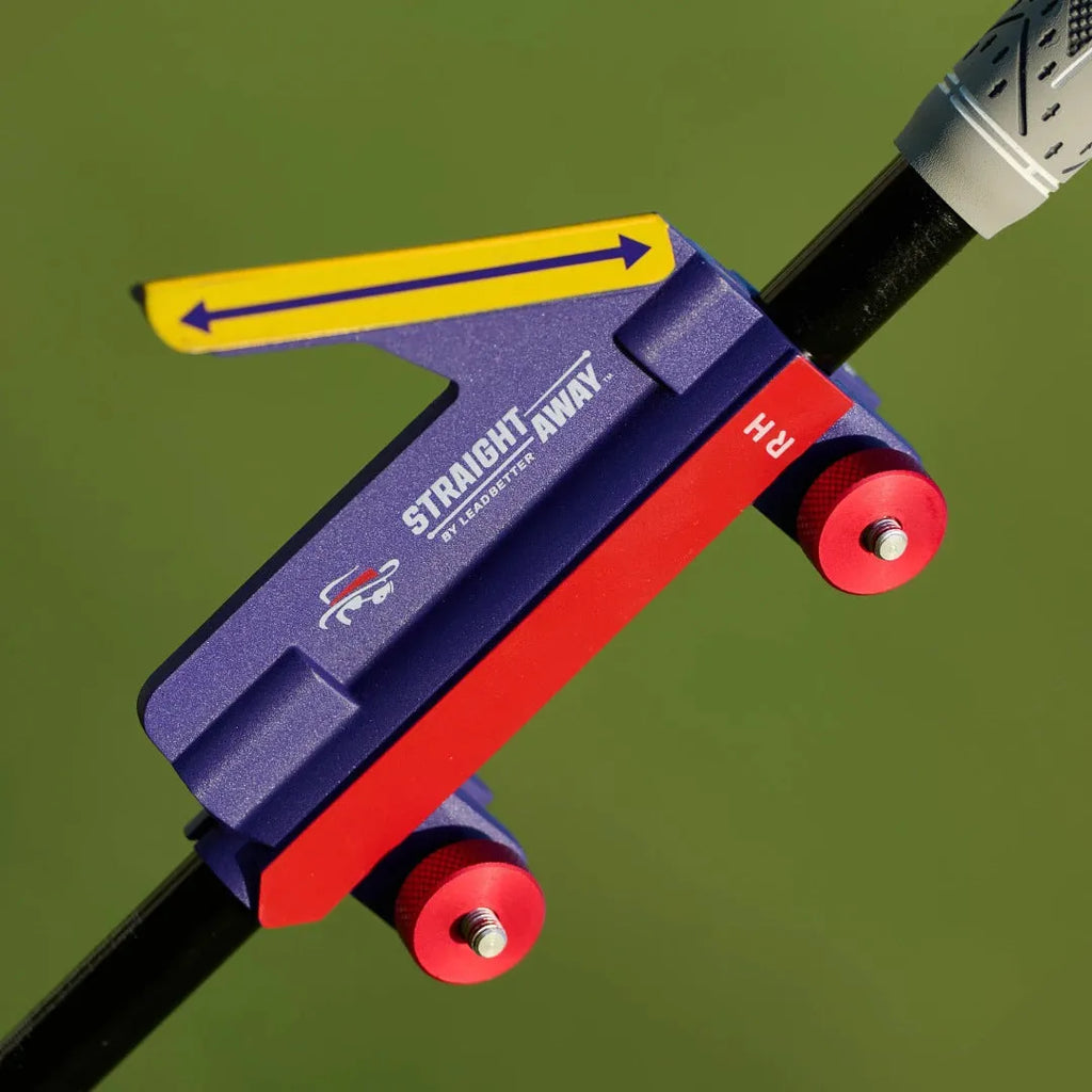 Plastic golf swing plane training simulator on a green background