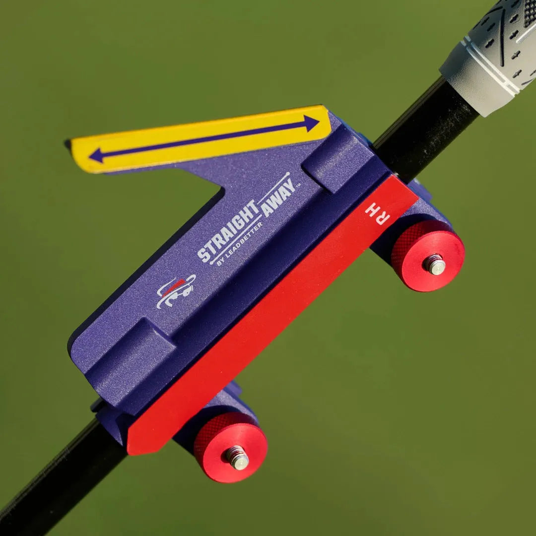 Plastic golf swing plane training simulator on a green background