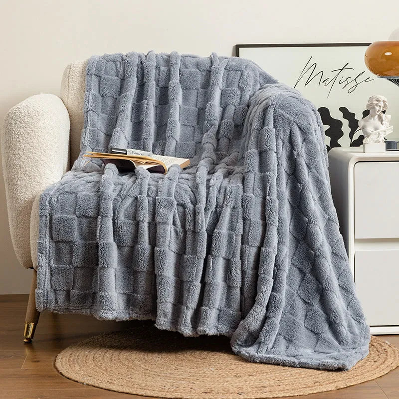 Geometric pattern polyester fleece blanket in creamy white colour showing thickened texture