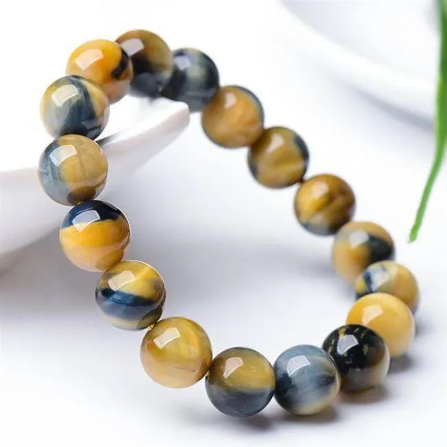 Handmade Fantasy Tiger Eye agate bracelet with round beads in geometric design.