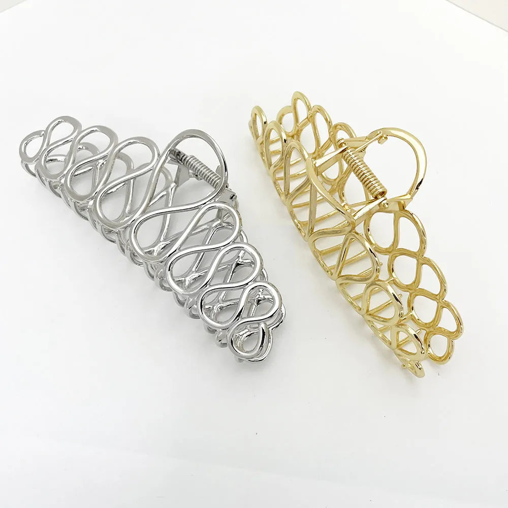 Minimalist large hair clip in gold electroplated alloy with tassel detail for thick hair