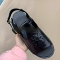 Men's black embroidered floral beach sandals with flat heel on a PU upper