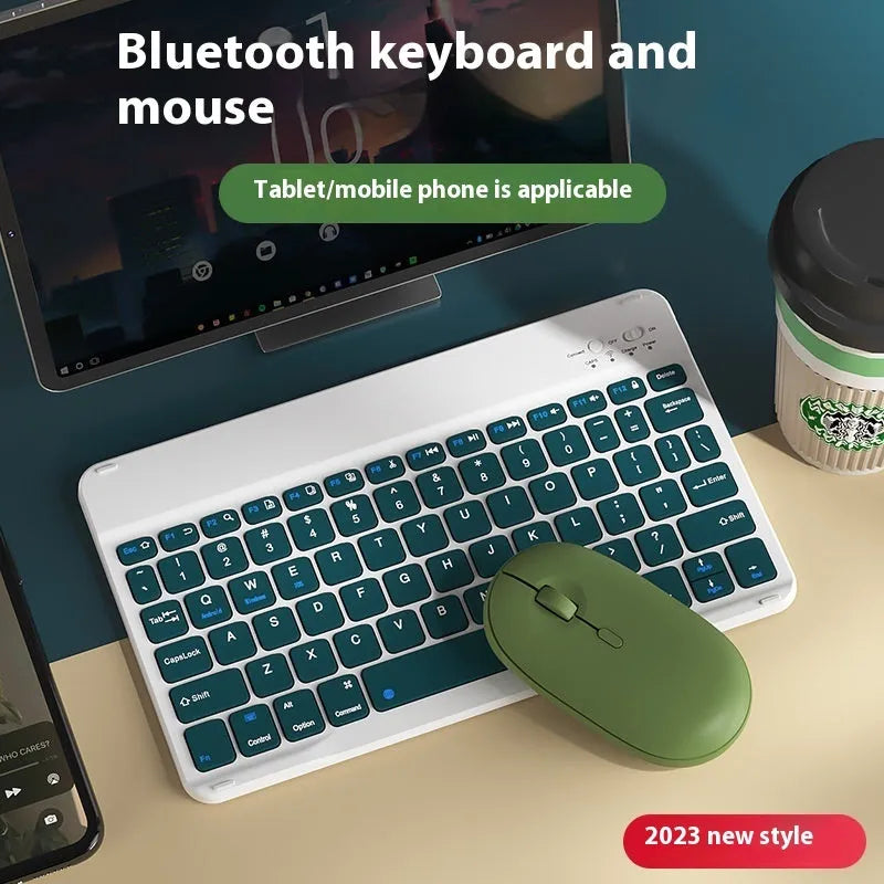 Compact white Bluetooth keyboard for tablet and PC use on a wooden desk