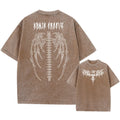 Men's oversized cotton t-shirt in a solid colour with drop-shoulder short sleeves on a grey background.
