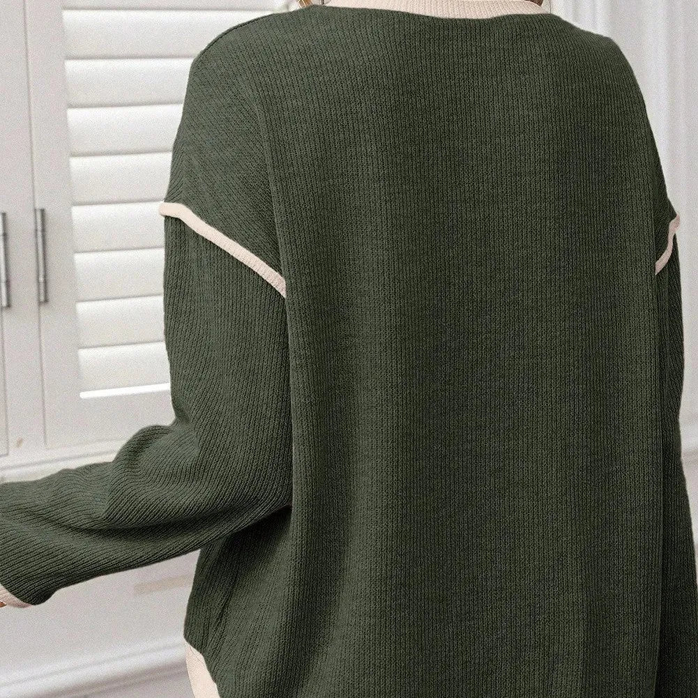 Woman wearing a loose drop shoulder knit top with contrast trim, shown in beige, light pink, and four leaf clover print colours.