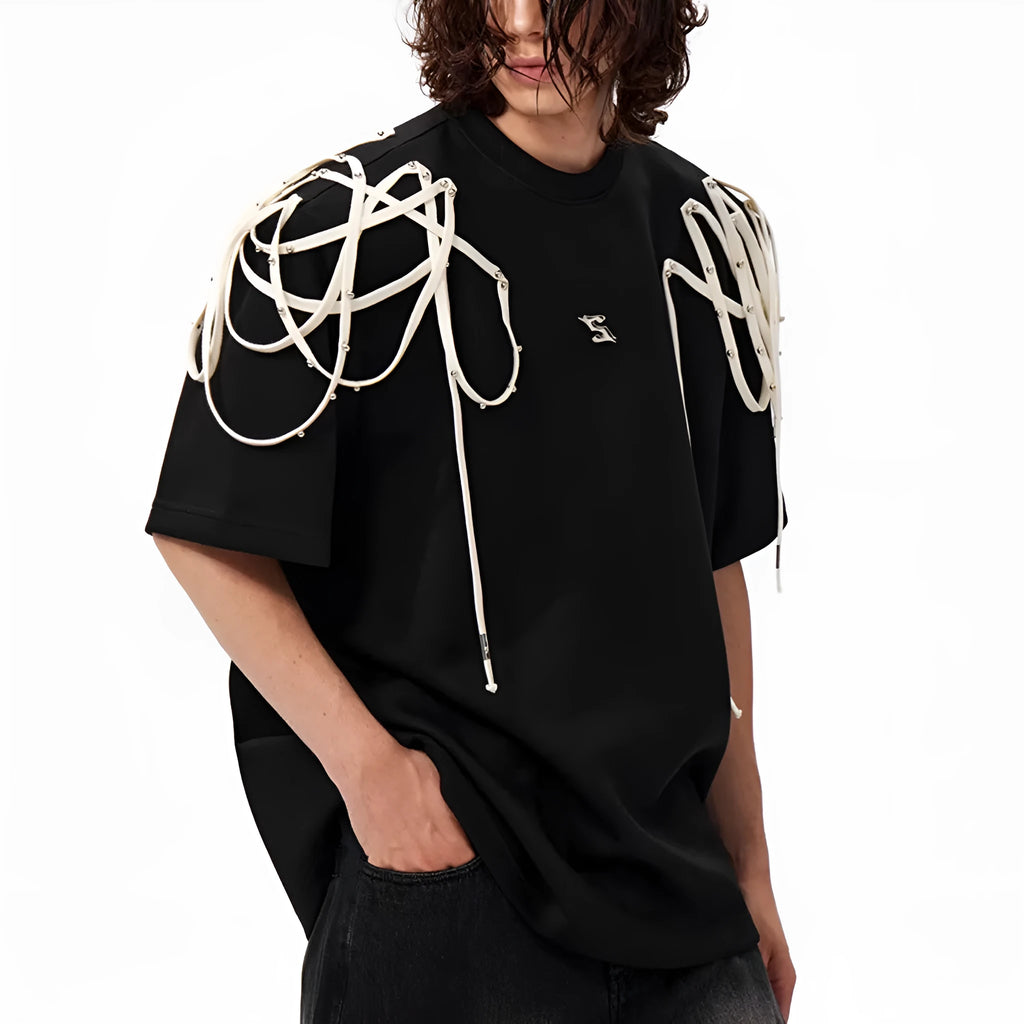 Black loose fit short-sleeved t-shirt with padded shoulder detail and rivet ribbon accents