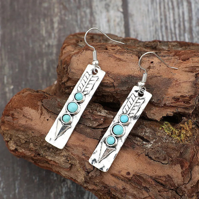 Long geometric silver earrings with turquoise inlays, zinc alloy construction