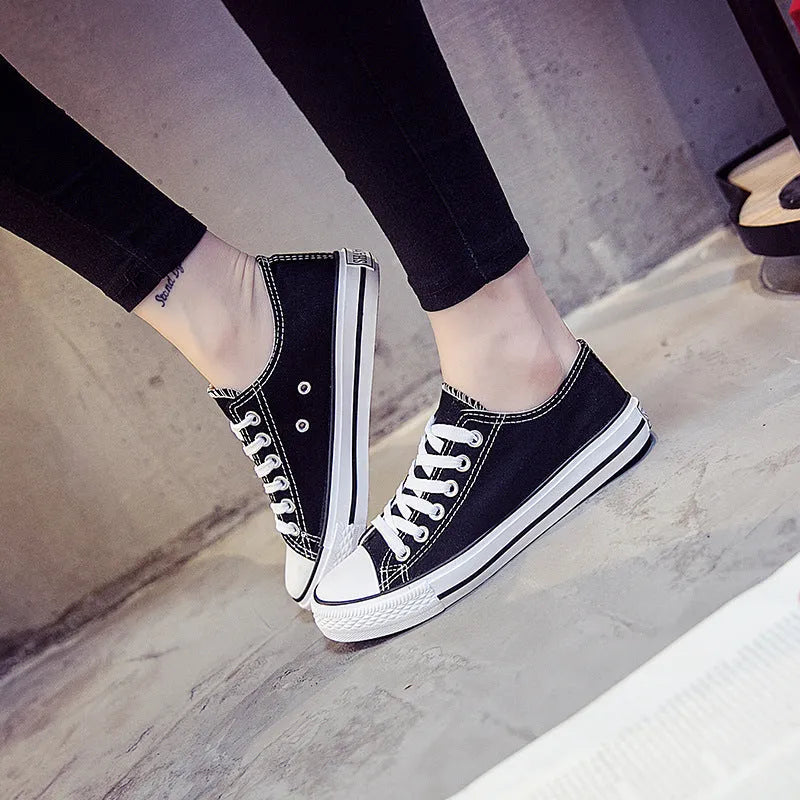 Women's solid colour canvas casual shoes on a plain background, showing the simple design.