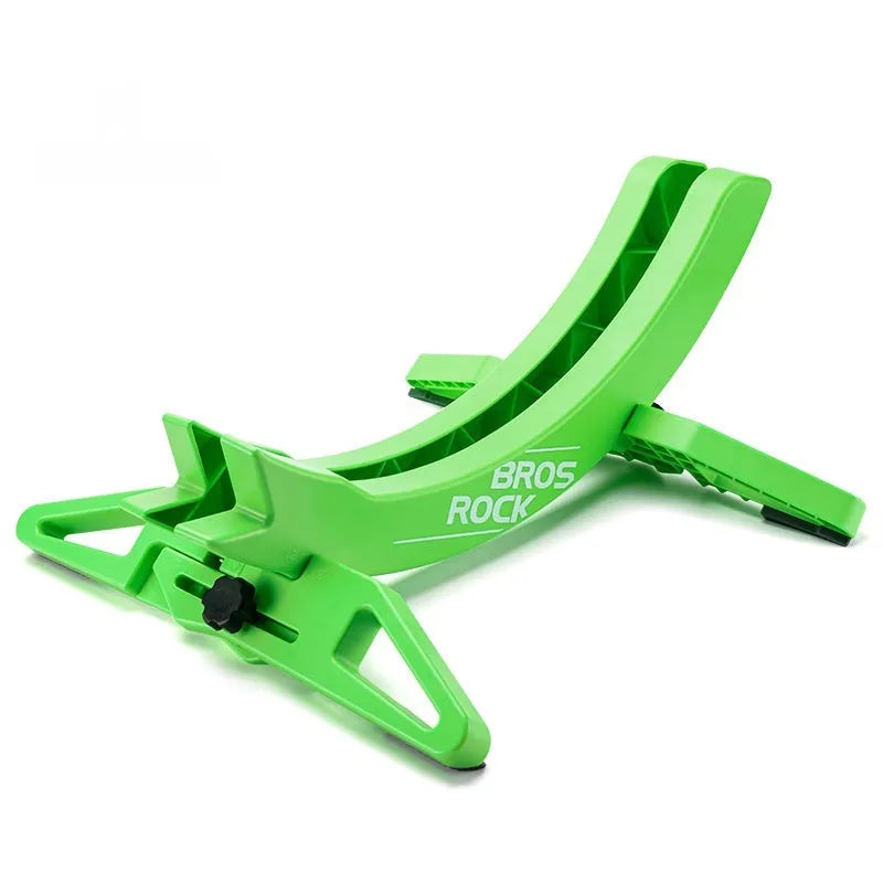 Black and green ABS plastic bicycle parking rack holder mounted on a wall.