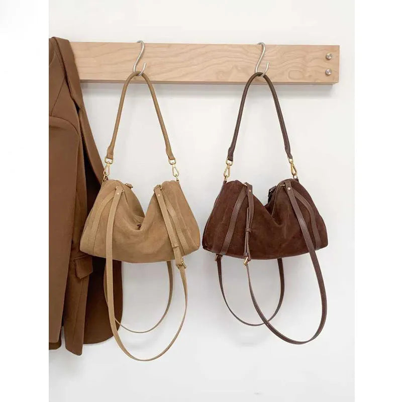 Vintage matte cowhide Boston bag in khaki or mocha coffee, 34x16x21cm, with shoulder and crossbody strap and outer pocket.