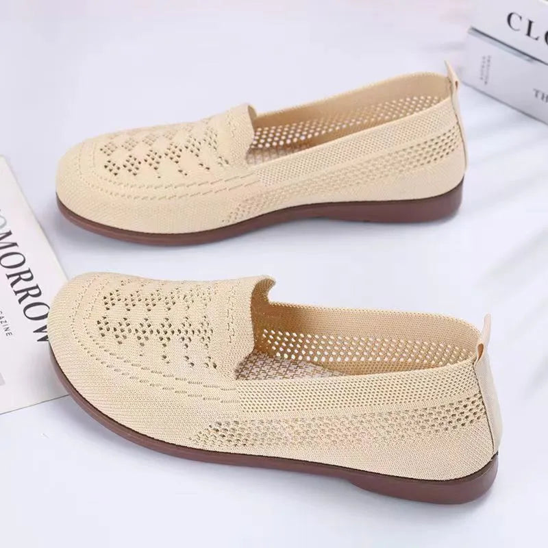 Beige low-top mesh casual trainers for women with a round toe and flat PVC sole.