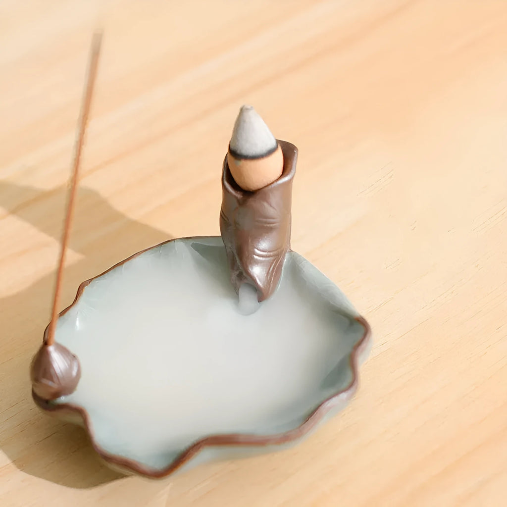 Ceramic reverse flow incense burner with purple clay finish and crystal glaze decorations