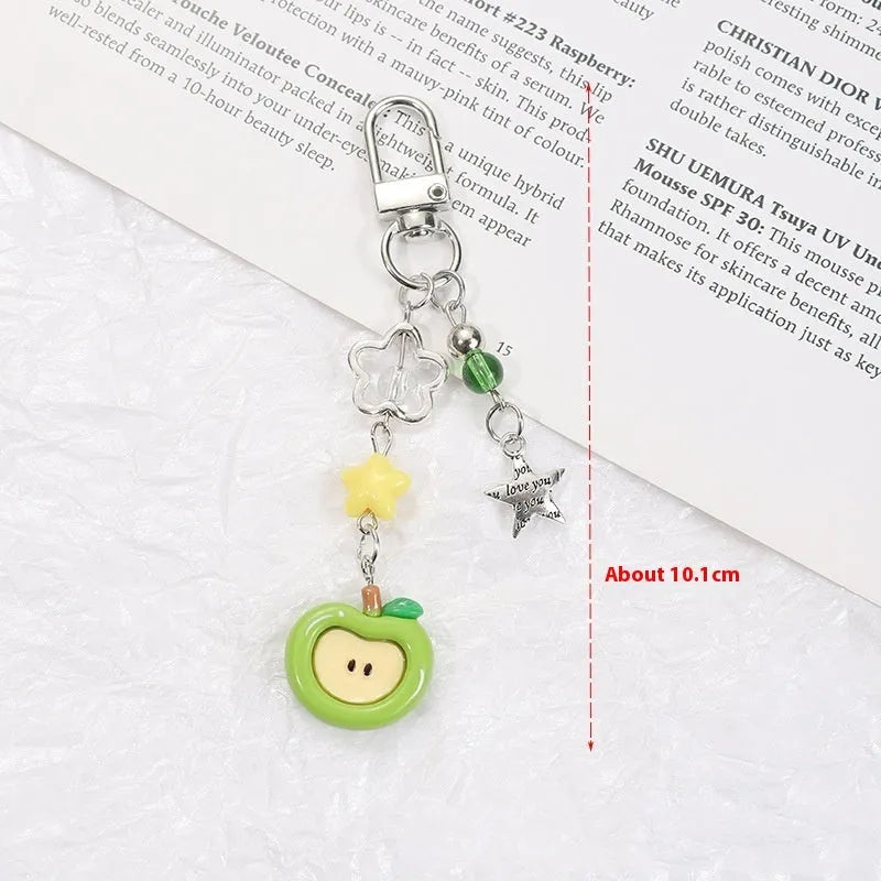 Plastic resin mobile phone charm keychain with fruit designs including apple and strawberry patterns