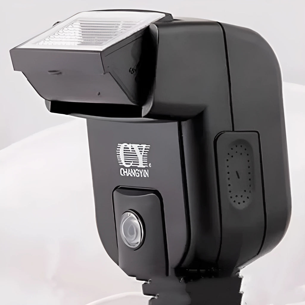 SLR camera flash accessory with tilted head shown on a hot shoe, displaying compact size.
