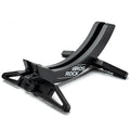 Black and green ABS plastic bicycle parking rack holder mounted on a wall.