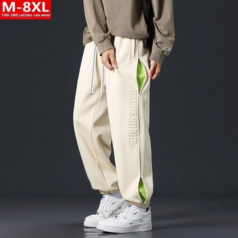 Men's loose-fit cotton trousers with stitching print detail and a banded ankle cuff.