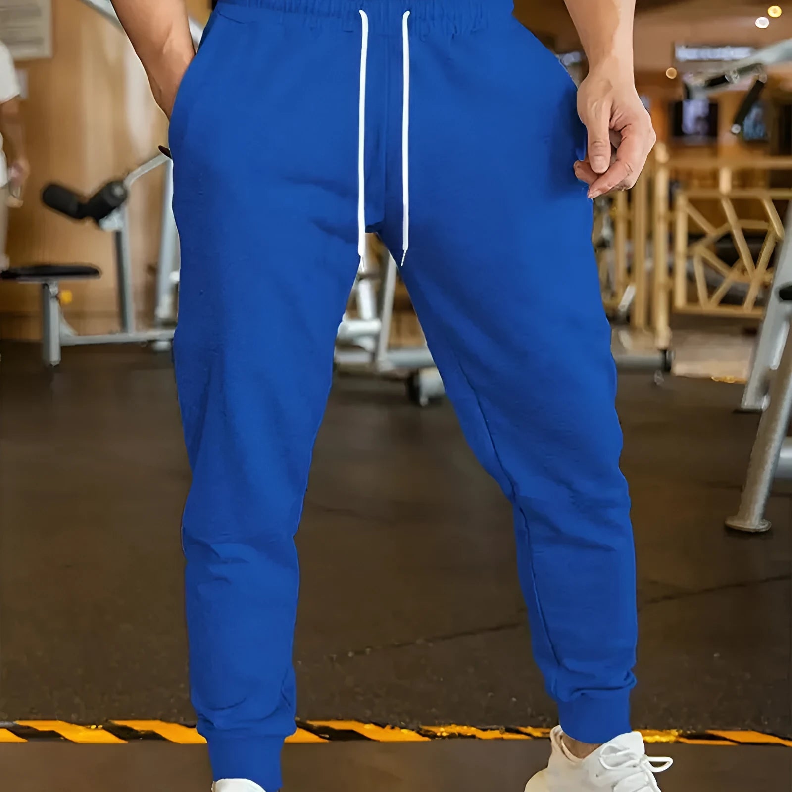 Men's loose-fit linen-style leisure trousers with an elastic drawstring waistband, shown in a neutral colour.