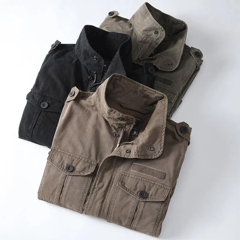Men's loose fit cotton twill jacket in light army green with zip front, shown on a model.