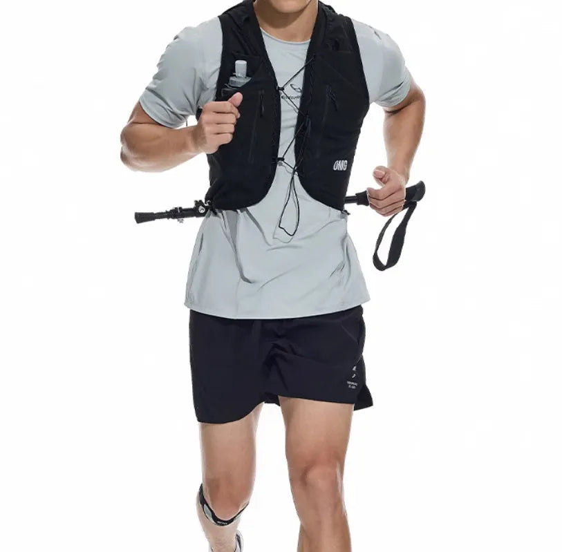 Men's black four-point running shorts with laser stitching on a flat surface, showing stretch fabric.