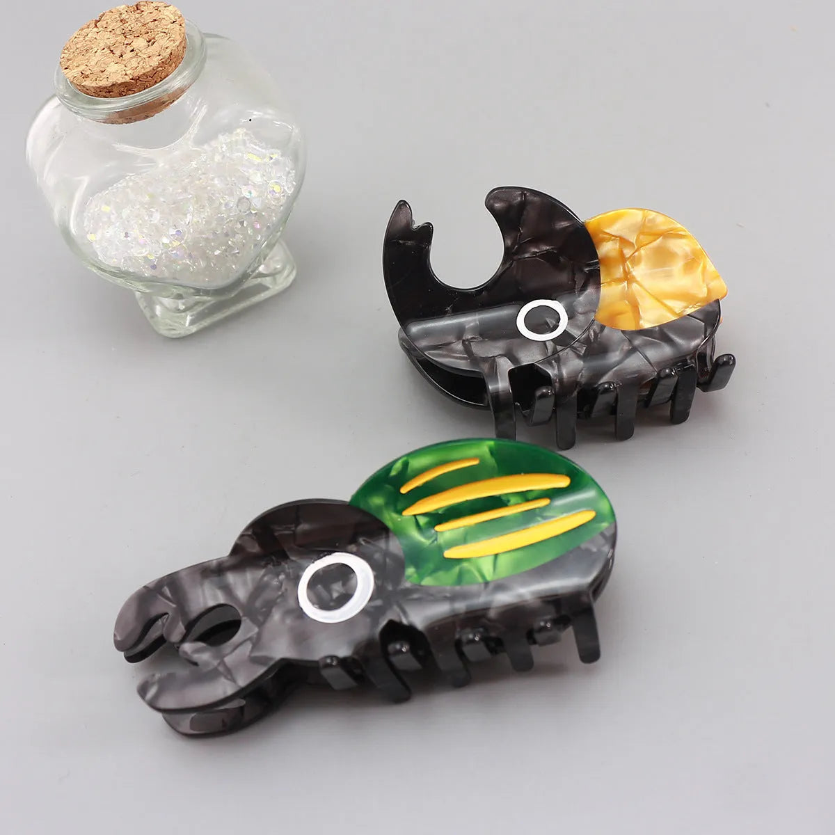 Handmade cellulose acetate beetle grip hair accessory with insect biology design