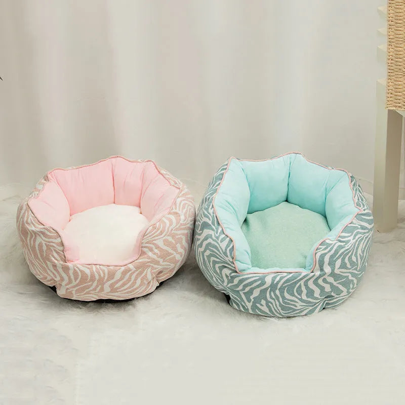 Octagonal grey pet bed with soft padded rim and removable inner mat for a small dog