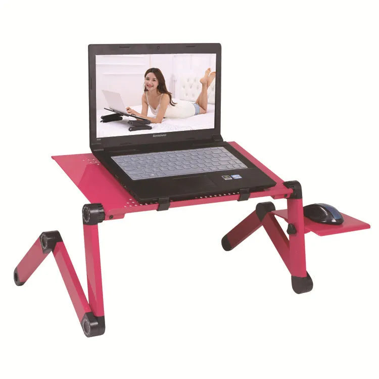 Black folding metal laptop desk with cooling fans and integrated mouse board extended on a carpet.