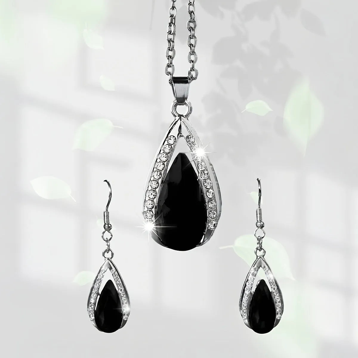Alloy teardrop pendant necklace and earrings set in black or red colour options