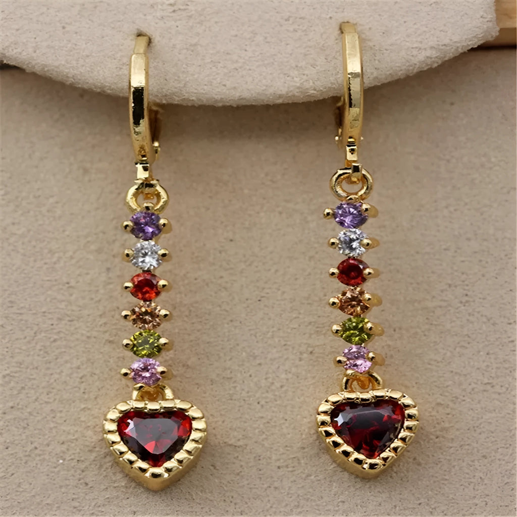 A pair of women's heart-shaped alloy earrings with a gold or silver electroplated finish.