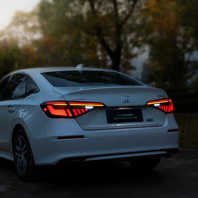 11th Generation Honda Civic black and red LED taillight assembly with sequential turn signals.