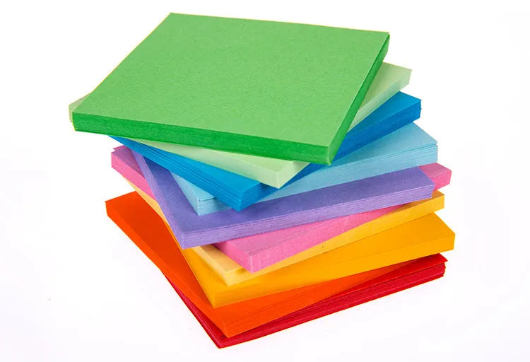 Assortment of colourful mini paper scrolls with metal eyelets for drift bottle messages and crafts.