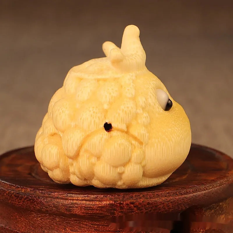 Solid bamboo Crown Princess Toad carving ornament in cute style on a plain background.